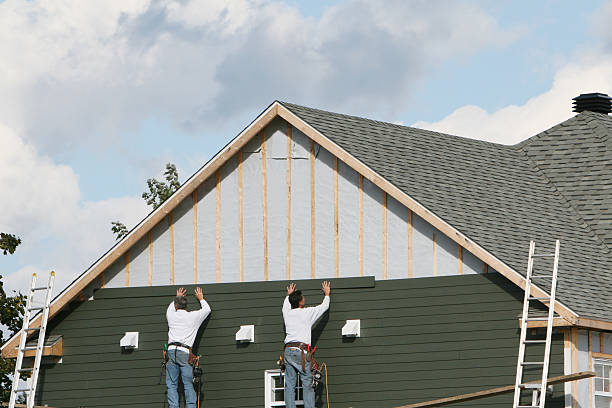 Professional Storm Damage Siding Repair technician working in Smithville, OH